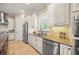 Modern kitchen with white cabinets and granite countertops at 3904 Waypoint Ave, Osprey, FL 34229