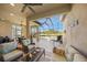 Covered lanai with wicker furniture and pool access at 3904 Waypoint Ave, Osprey, FL 34229