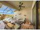 Relaxing lanai with wicker furniture and pool view at 3904 Waypoint Ave, Osprey, FL 34229