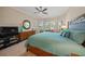 Comfortable main bedroom with a king-size bed and beautiful window view at 3904 Waypoint Ave, Osprey, FL 34229