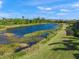 Peaceful pond with lush green landscaping at 3904 Waypoint Ave, Osprey, FL 34229