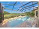 Relaxing pool and spa area with screened enclosure and lush landscaping at 3904 Waypoint Ave, Osprey, FL 34229