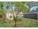 View of backyard with shed, pergola, and lush landscaping at 4536 1St N Ave, St Petersburg, FL 33713