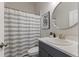 Bathroom with shower and dark vanity at 4697 Antrim Dr, Sarasota, FL 34240