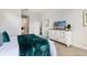 Serene bedroom with a dresser and view of the bathroom at 4697 Antrim Dr, Sarasota, FL 34240