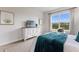 Comfortable bedroom with large window and dresser at 4697 Antrim Dr, Sarasota, FL 34240