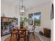 Charming dining area with round wooden table and four chairs at 4697 Antrim Dr, Sarasota, FL 34240