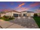 Two-story home with a three-car garage and paver driveway at 4697 Antrim Dr, Sarasota, FL 34240