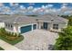 Two-story home with a three-car garage and landscaped yard at 4697 Antrim Dr, Sarasota, FL 34240