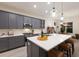Open kitchen with island, stainless steel appliances, and a breakfast nook at 4697 Antrim Dr, Sarasota, FL 34240