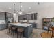 Modern kitchen featuring a large island with quartz countertops and gray cabinetry at 4697 Antrim Dr, Sarasota, FL 34240
