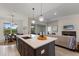 Eat-in kitchen with island, stainless steel appliances and open floor plan at 4697 Antrim Dr, Sarasota, FL 34240