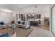 Open concept kitchen with island, stainless steel appliances, and gray cabinets at 4697 Antrim Dr, Sarasota, FL 34240