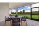 Screened patio with seating area overlooking backyard at 4697 Antrim Dr, Sarasota, FL 34240