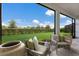Relaxing patio with seating area and view of green space at 4697 Antrim Dr, Sarasota, FL 34240