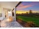 Screened patio with seating area and sunset view at 4697 Antrim Dr, Sarasota, FL 34240