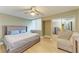 Spacious bedroom with large bed and a light beige color scheme at 4918 25Th W St # 102, Bradenton, FL 34207