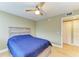 Bedroom with double bed, ceiling fan, and built-in dresser at 4918 25Th W St # 102, Bradenton, FL 34207