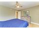 Bedroom with double bed, dresser, and access to bathroom at 4918 25Th W St # 102, Bradenton, FL 34207