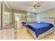 Bedroom with a double bed, ceiling fan, and mirrored closet doors at 4918 25Th W St # 102, Bradenton, FL 34207