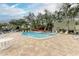Relaxing community pool with lounge chairs and pergola at 4918 25Th W St # 102, Bradenton, FL 34207