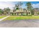 Tan colored two-story condo building with lush landscaping and a walkway at 4918 25Th W St # 102, Bradenton, FL 34207