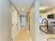 Light and bright hallway with light wood laminate flooring at 4918 25Th W St # 102, Bradenton, FL 34207