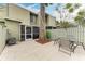 Spacious patio with a large tree and seating area at 4918 25Th W St # 102, Bradenton, FL 34207