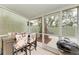 Screened patio with outdoor dining set and grill at 4918 25Th W St # 102, Bradenton, FL 34207