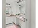Double vanity bathroom with granite countertop and modern light fixtures at 5107 86Th Street W Ct, Bradenton, FL 34210