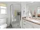 Bathroom with a shower stall, granite vanity, and neutral tile at 5107 86Th Street W Ct, Bradenton, FL 34210