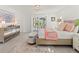Bright bedroom with sliding doors to patio, plush carpet, and neutral decor at 5107 86Th Street W Ct, Bradenton, FL 34210
