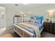 Bright bedroom with full-size bed, dresser, and soft color palette at 5107 86Th Street W Ct, Bradenton, FL 34210