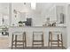 Modern kitchen with white cabinets and breakfast bar at 5107 86Th Street W Ct, Bradenton, FL 34210