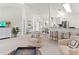 Bright and airy living room with views into adjacent dining area at 5107 86Th Street W Ct, Bradenton, FL 34210