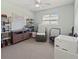 Home office features built-in shelving, comfortable seating, and ample workspace at 5107 86Th Street W Ct, Bradenton, FL 34210