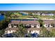 Aerial view of community, lake, golf course, and building at 5240 Hyland Hills Ave # 1411, Sarasota, FL 34241