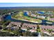 Aerial view of community with lake and golf course at 5240 Hyland Hills Ave # 1411, Sarasota, FL 34241