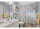 Simple bathroom with shower/tub combo and updated vanity at 5240 Hyland Hills Ave # 1411, Sarasota, FL 34241