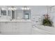 Elegant bathroom with double vanity and a relaxing bathtub at 5240 Hyland Hills Ave # 1411, Sarasota, FL 34241