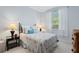 Cozy bedroom with a queen-size bed and stylish decor at 5240 Hyland Hills Ave # 1411, Sarasota, FL 34241