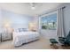 Spacious bedroom with a large window and comfortable seating at 5240 Hyland Hills Ave # 1411, Sarasota, FL 34241