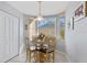 Cozy breakfast nook with a charming table and chairs at 5240 Hyland Hills Ave # 1411, Sarasota, FL 34241