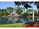 Waterfront entrance to community with fountain and landscaping at 5240 Hyland Hills Ave # 1411, Sarasota, FL 34241