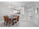 Bright dining area with a view into the kitchen and entryway at 5240 Hyland Hills Ave # 1411, Sarasota, FL 34241