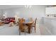Elegant dining room features a wooden table and chairs at 5240 Hyland Hills Ave # 1411, Sarasota, FL 34241