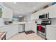 Well-equipped kitchen with stainless steel appliances and ample counter space at 5240 Hyland Hills Ave # 1411, Sarasota, FL 34241