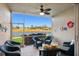 Screened lanai overlooking a peaceful lake view at 5240 Hyland Hills Ave # 1411, Sarasota, FL 34241
