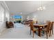 Spacious living and dining area with golf course view at 5240 Hyland Hills Ave # 1411, Sarasota, FL 34241