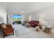 Bright living room with patio access and golf course view at 5240 Hyland Hills Ave # 1411, Sarasota, FL 34241